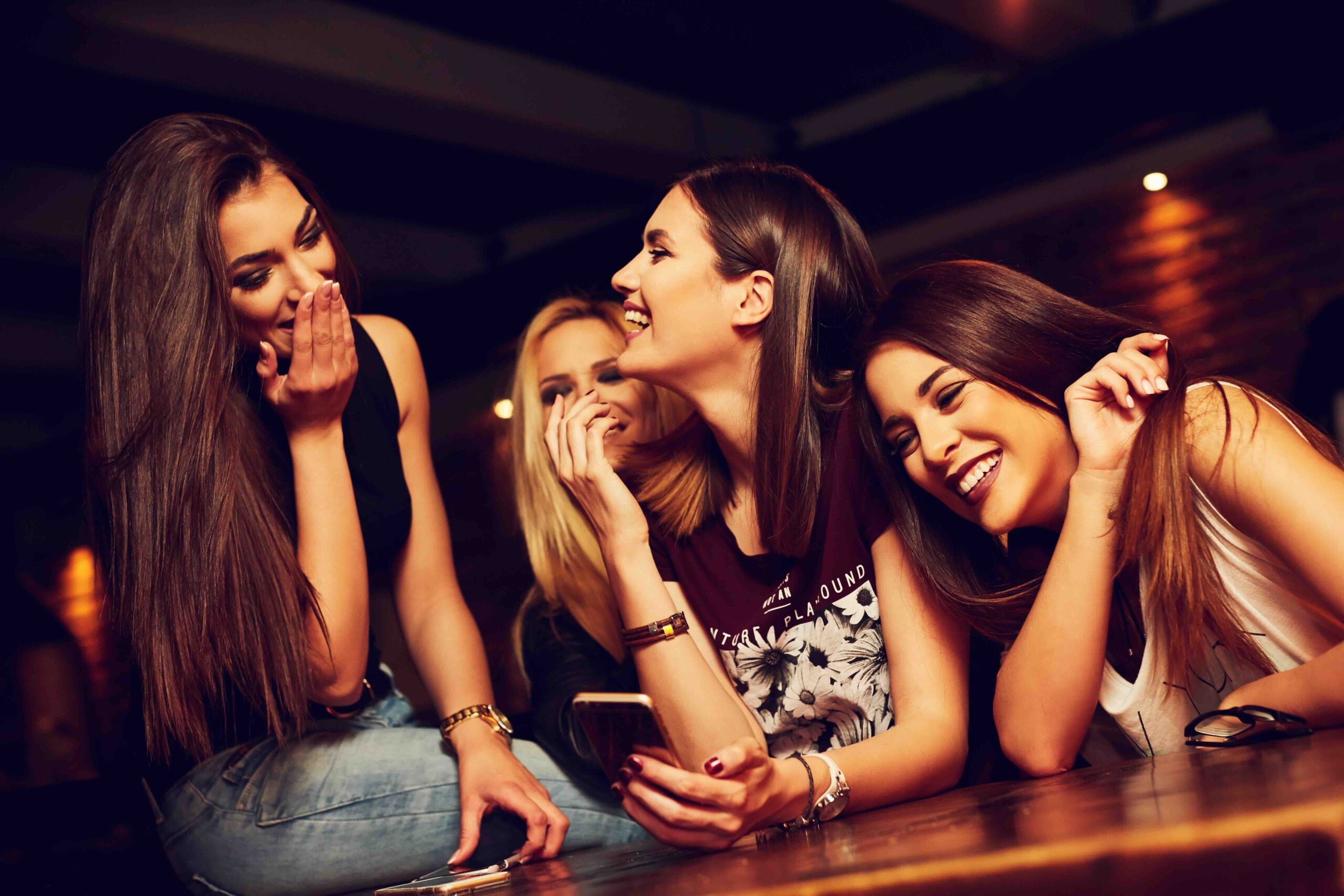 Group,of,young,women,friends,having,fun,looking,at,something